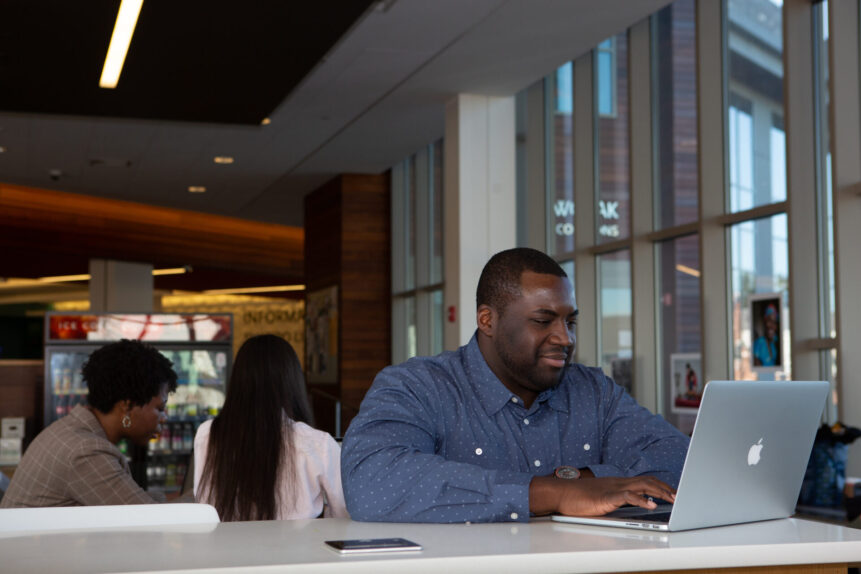 SNHU student working on laptop