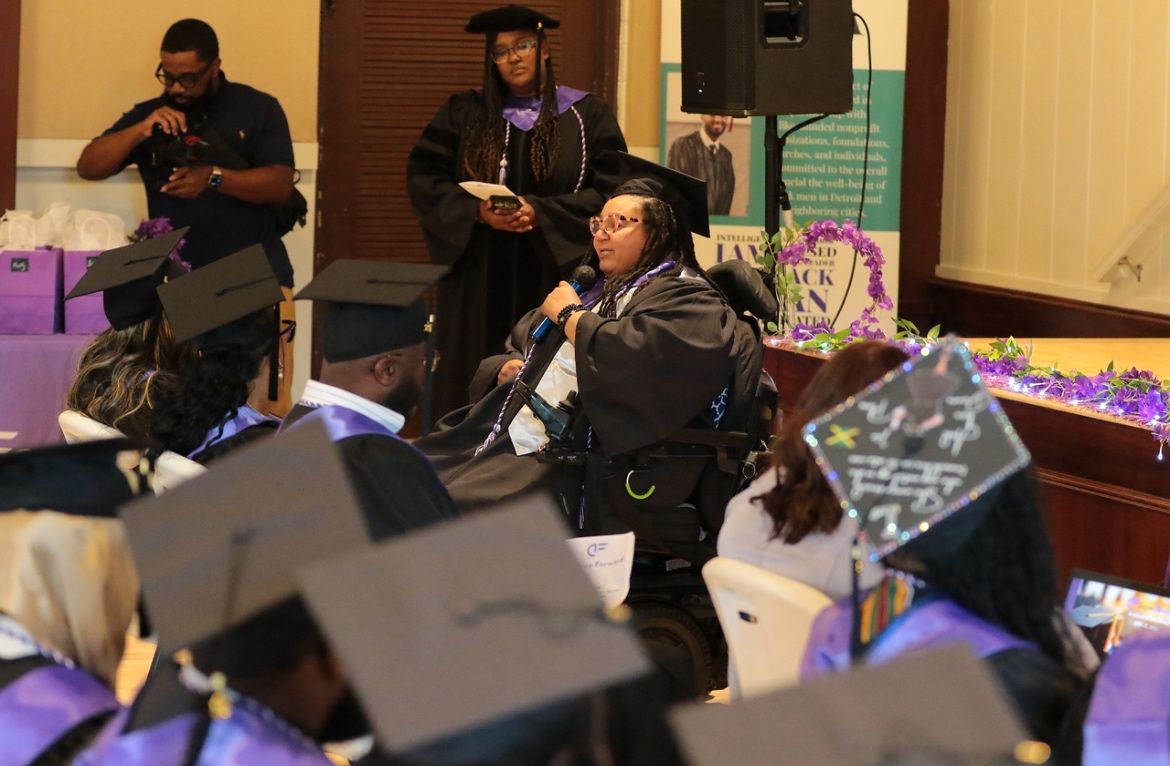 Jamie Junior speaking at graduation ceremony